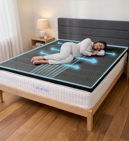 Woman sleeping on her side on Turmerry Graphite Latex Topper with blue airflow arrows indicating cooling circulation.