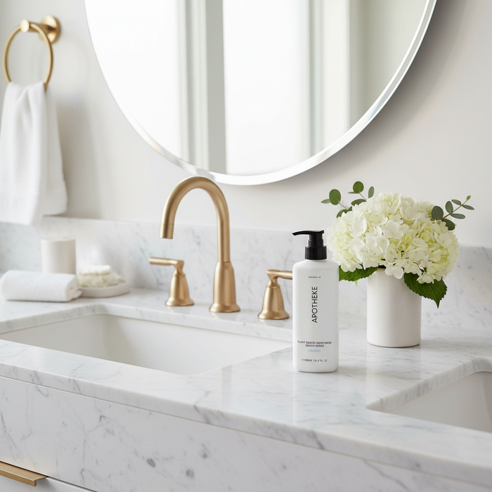 Apotheke Canvas hand wash on marble vanity beside sink — luxury hotel hand wash Crowne Plaza Voco plant-based