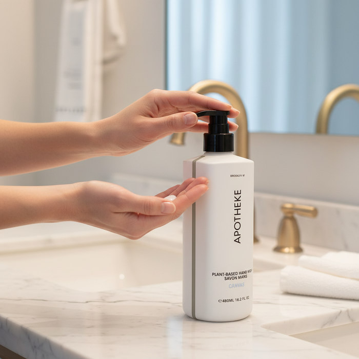 Hands using Apotheke Canvas hand wash at luxury marble sink — hotel spa hand wash plant-based vegan