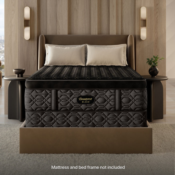 Beautyrest Black Standard Foundation with a Beautyrest Black Mattress on top of it, both sitting in a brown bedframe with 2 pillows on top of it