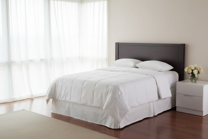 IHG Medium Weight Duvet Insert - King on a neatly made bed in a bright room with natural light.
