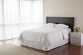 IHG Medium Weight Duvet Insert - King on a neatly made bed in a bright room with natural light.