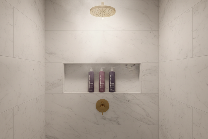Kevin Murphy Young.Again 3-piece hair and body care set in luxury hotel shower niche — restorative shampoo conditioner body wash