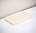 Turmerry low profile toddler pillow with white cover displayed on white bed.