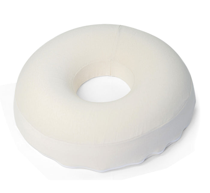 Turmerry latex donut pillow with center cutout displayed from angled top view on white background.