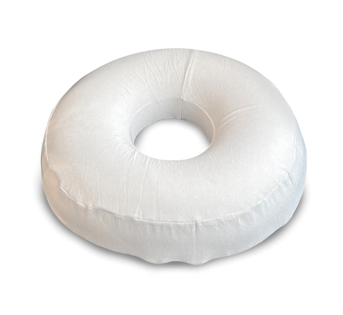 Turmerry latex donut pillow with white cover and center opening shown from top view.