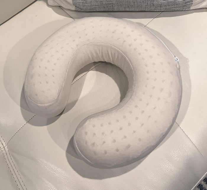 Top-down view of Turmerry latex travel neck pillow showing contoured support design and textured cover.