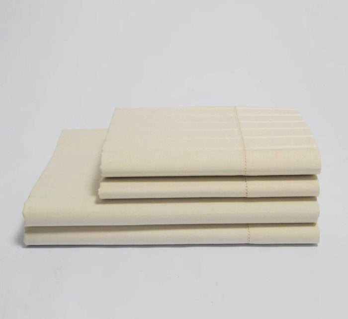 Turmerry organic luxury sateen striped bed sheet set folded and stacked.