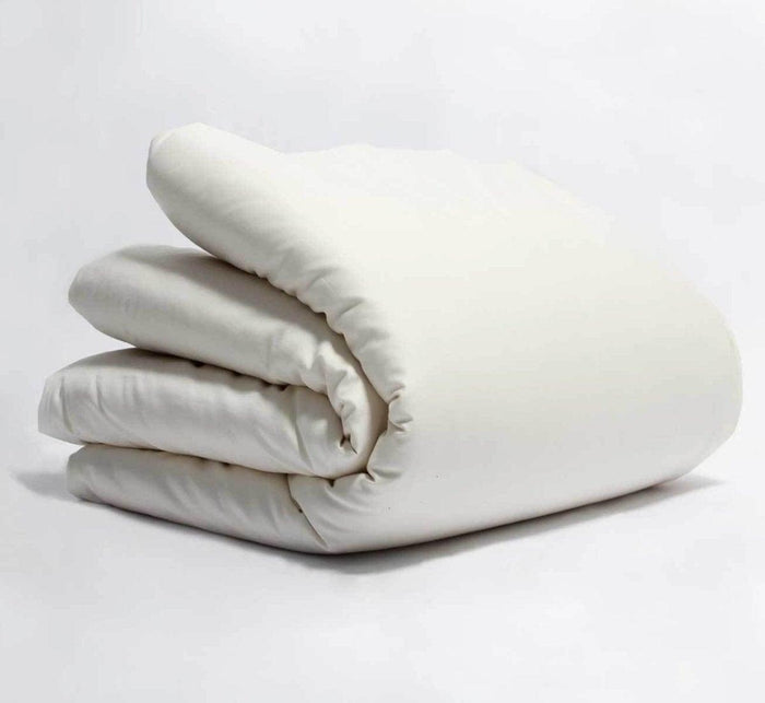 Turmerry Organic Sateen Duvet Cover put on a folded duvet, on a light gray background.