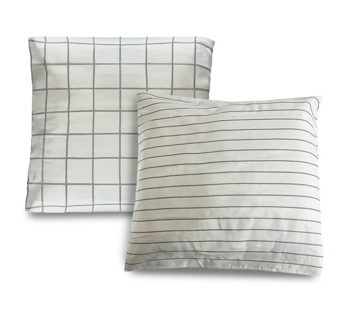 Turmerry organic sateen euro pillowcases with black stripes and checks on two white covers, on white background.