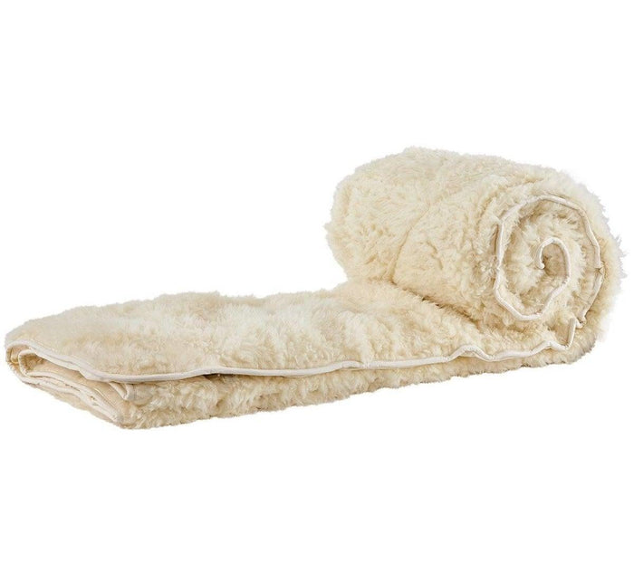 Turmerry Reversible Mattress Pad rolled showing cream fleece side with white fabric binding.