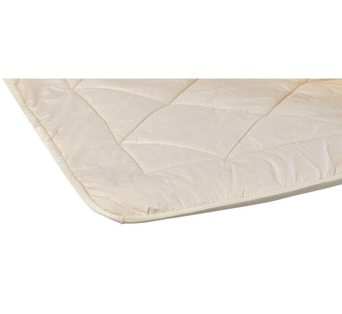 Turmerry Reversible Mattress Pad unrolled showing quilted cotton and wool side with diamond stitching pattern.