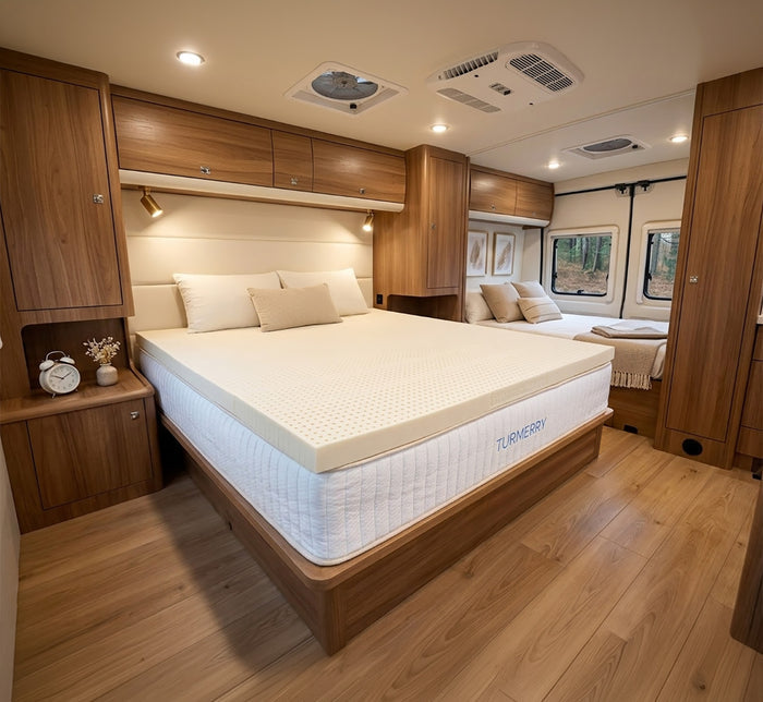 Turmerry Latex RV Mattress Topper on a Turmerry bed in luxury RV with wood cabinetry and ambient lighting.