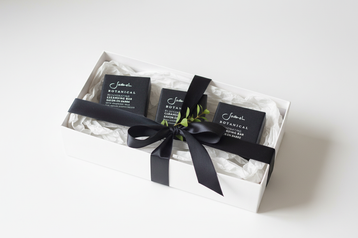Three Sodashi Botanical Cleansing Bars in luxury gift box with black ribbon