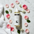 REN Rosa Centifolia Facial Cleansing Gel flat lay with rose petals on white marble