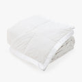 Full view of The Pillow Bar All Season White Down Blanket Folded
